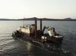Spud barge with excavator